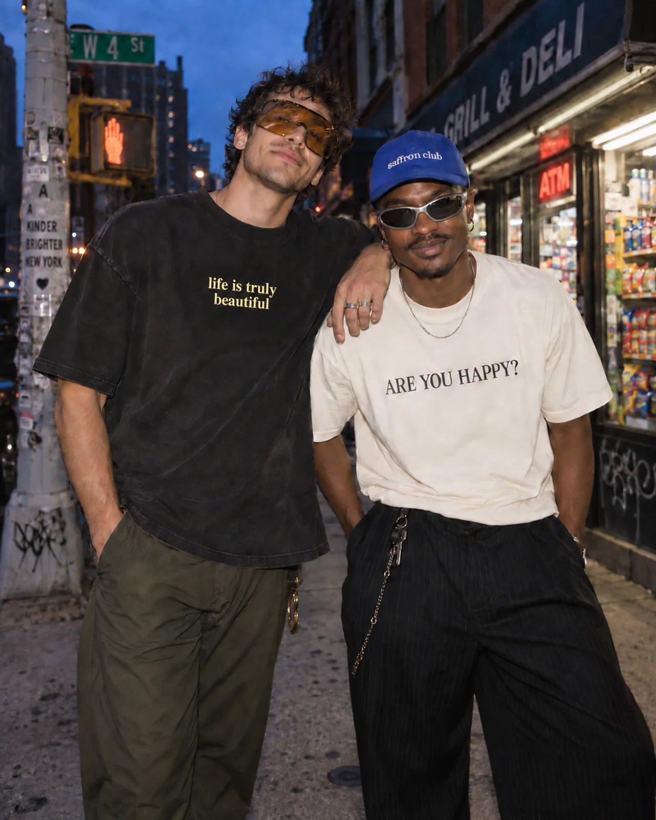 Adult men in Saffron Club streetwear and statement sunglasses